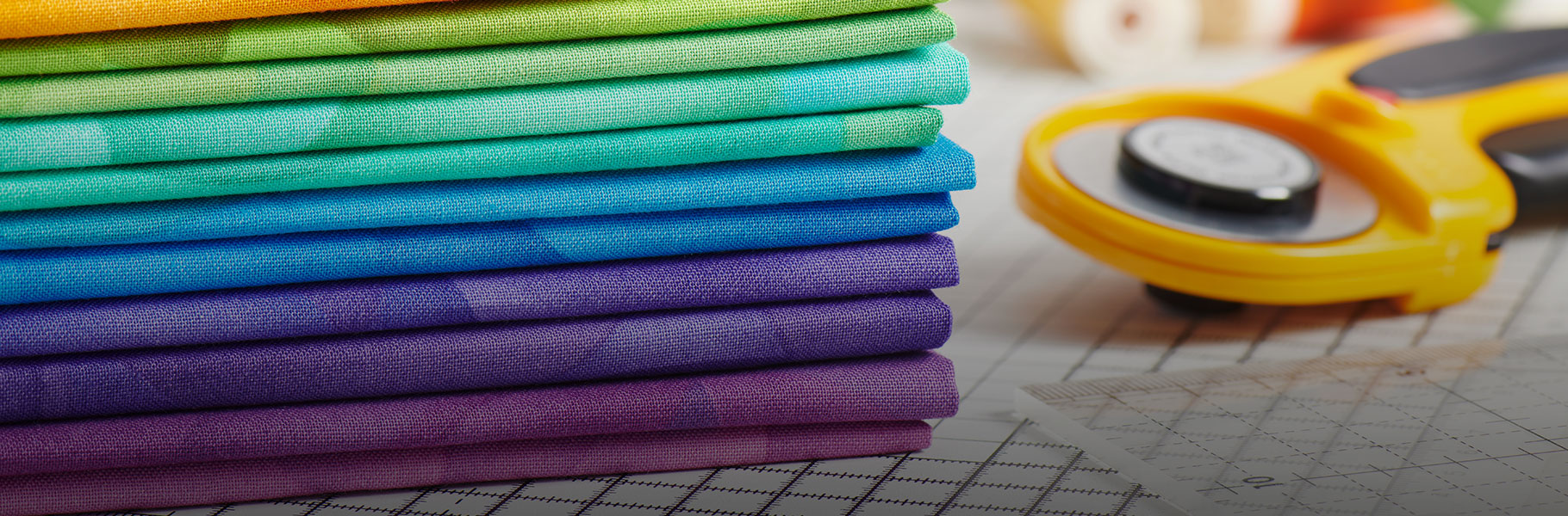 quilting fabrics in multiple colors and other quilting tools