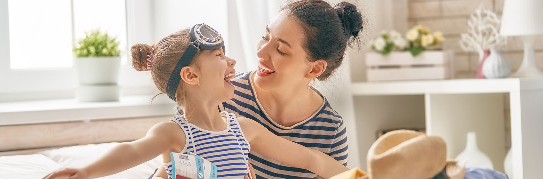 Mother and daughter packing suitcases