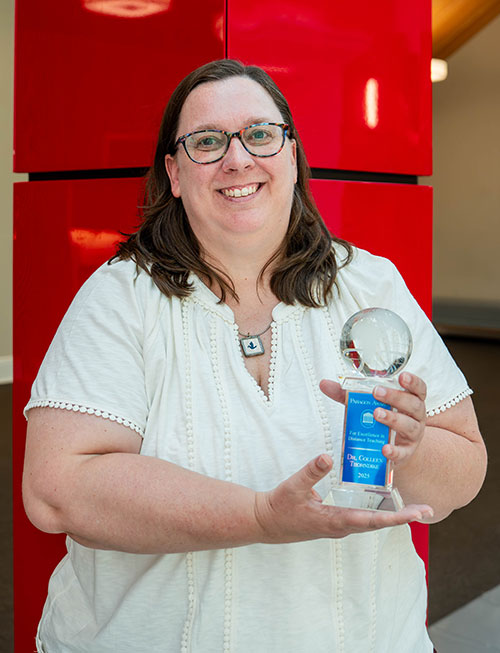 Dr. Durkin holding paragon award