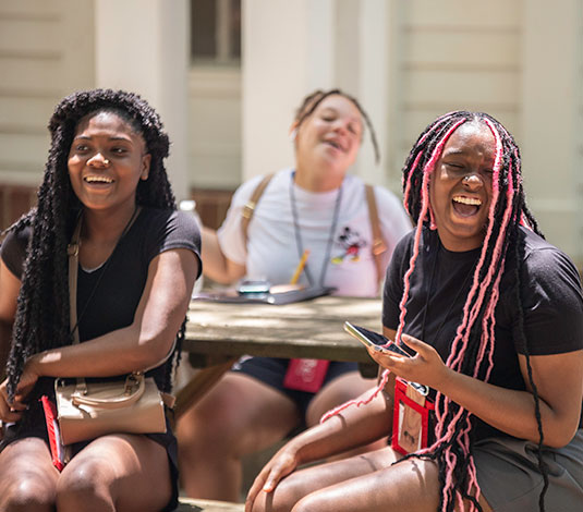 Students gathered together and laughing