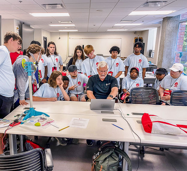 students working on engineering project with an instructor