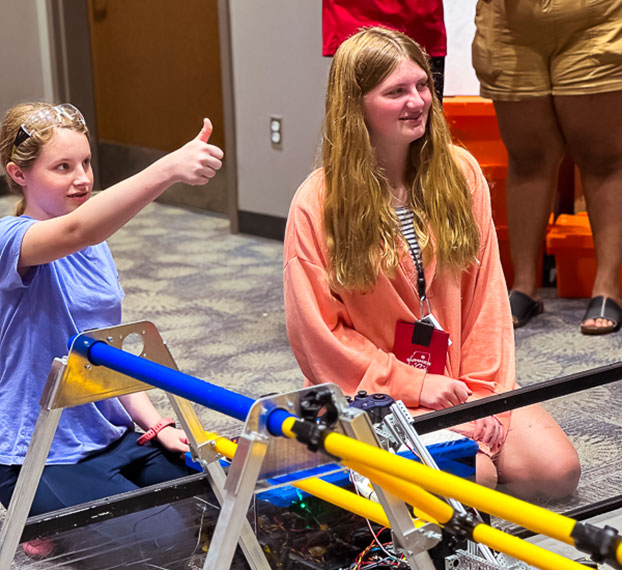 students testing robotics project in arena