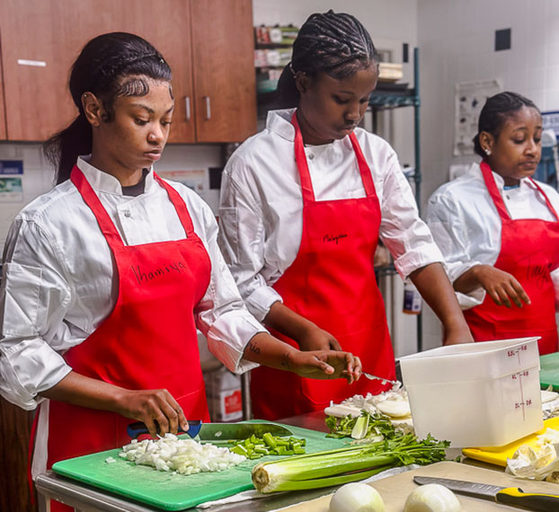 students serving food at table