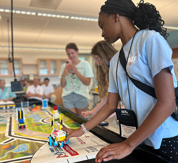 students working on racing robots