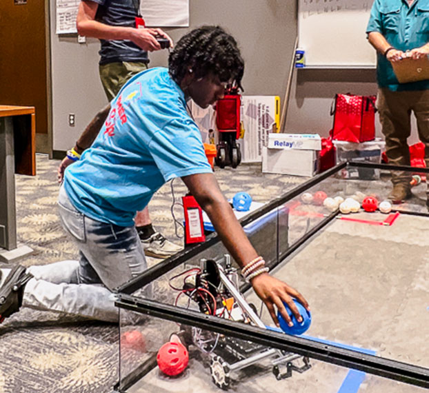 student testing robotics project in arena