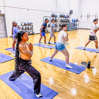 students doing organized exercise in turner center on ole miss campus