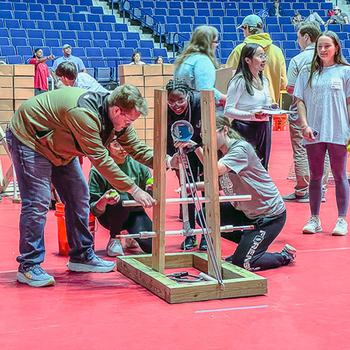 Catapult Competition participants testing catapult