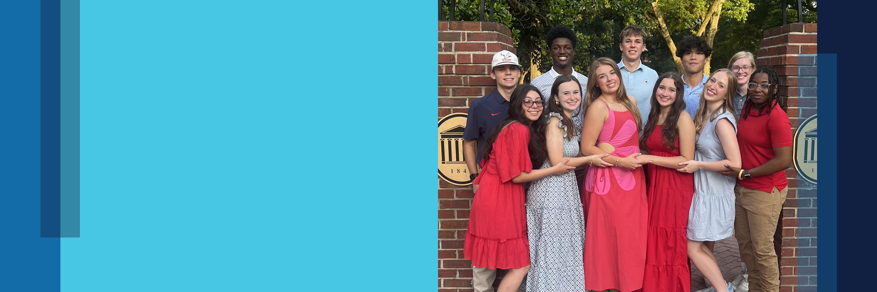 Students gathered by the Walk of Champions Arch in the Grove at Ole Miss